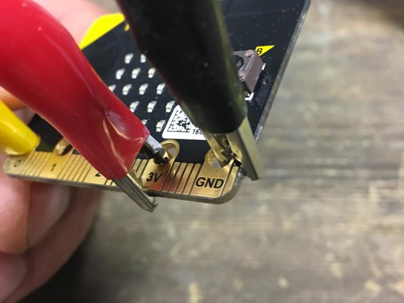 Clippiing the cables to the edge of the board