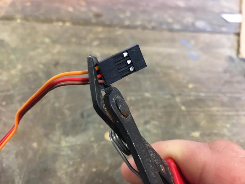 Cutting of the plastic connector from the servo cable