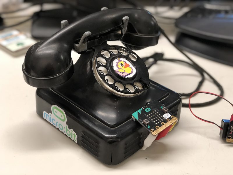 A rotary dial phone connected to a micro:bit